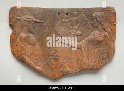 Hermes and Aphrodite. Greek terracotta votive tablet from 475-450 BC found in South Italy on display in the Staatliche Antikensammlungen (Bavarian State Collection of Antiques) in Munich, Bavaria, Germany. Eros is depicted on the hand of Aphrodite. Stock Photo