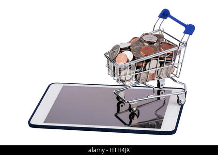Shopping basket full of US coins on a tablet pc isolated on a white background Stock Photo