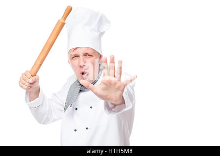 Active chef learns martial arts oriental with a rolling pin in hand Stock Photo