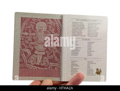 Page 2 in the Danish passport displays the figure of Christ from the Jelling rune stone raised by Viking king Harald Bluetooth in the 10th century Stock Photo