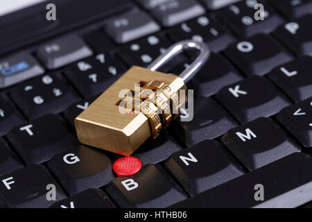 golden lock on black keyboard - computer security concept, internet privacy Stock Photo