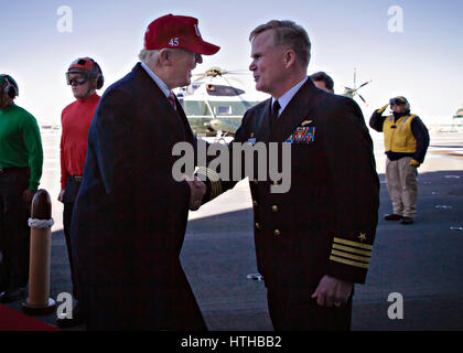 U.S. President Donald Trump is welcomed by ships Captain Rick McCormack upon his arrival aboard aboard the new Gerald R. Ford-class aircraft carrier USS Gerald R. Ford during a pre-commissioning ceremony at Newport News Shipbuilding yard March 2, 2017 in Newport News, Virginia.    (photo by MCS3 Cathrine Mae O. Campbell /US Navy  via Planetpix) Stock Photo