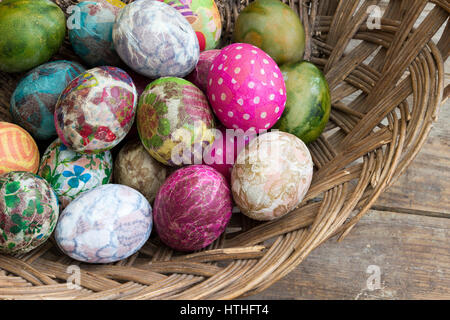 Colorful painted and decorated Easter eggs in a basket Stock Photo