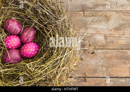 Pink Easter eggs in the nest, made in the technique of decoupage Stock Photo
