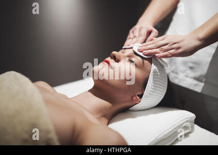 Woman enjoying skin and face treatment and massage Stock Photo