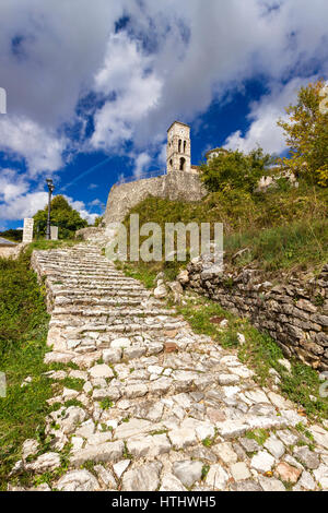 Stone paved path in the picturesque village of Kalarrytes, in Tzoumerka region, near Ioannina town, Epirus, Greece. Stock Photo