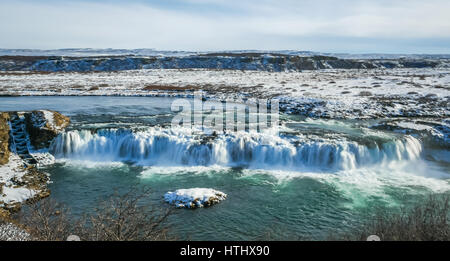 A broad frozen waterfall in Iceland in Winter Stock Photo
