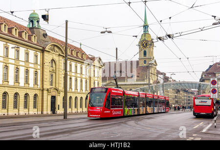 BERN, SWITZERLAND - FEBRUARY 15: Siemens Combino tram on Bubenbergplatz in Bern on February 15, 2015. There are 36 trams of this class in Bern Stock Photo