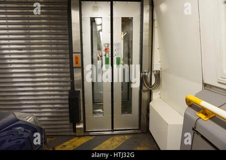 FOLKESTONE, ENGLAND, MAY 07 2016: Connecting doors between carriages on the Euro Tunnel train from Coquelles, France to Folkestone in the United Kingd Stock Photo