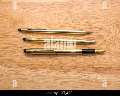 A matching set of three Cross brand writing implements pencil, ball point pen and fountain pen Stock Photo