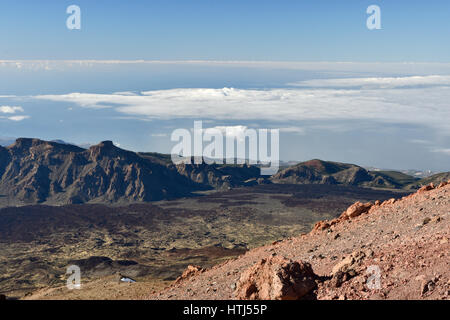 View from Teide to the east over the outer volcano ring with blue sky and clouds in background, picture from Tenerife Spain. Stock Photo