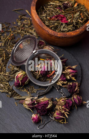 Green tea with roses blossoms Stock Photo