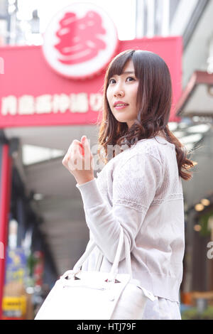 Fashionable Japanese woman at a traditional shopping street, Tokyo, Japan Stock Photo