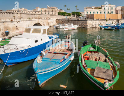 SYRACUSE, ITALY - SEPTEMBER 14, 2015: Fishing boats in the city of Syracuse, Sicily Stock Photo