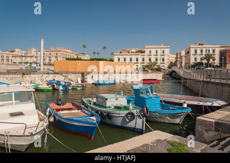 SYRACUSE, ITALY - SEPTEMBER 14, 2015: Fishing boats in the city of Syracuse, Sicily Stock Photo