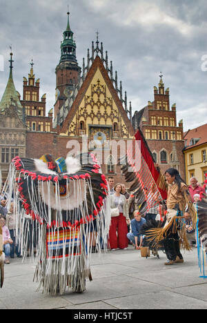 South American Indians performing at Rynek in front of medieval Town Hall in Wroclaw, Lower Silesia, Poland Stock Photo