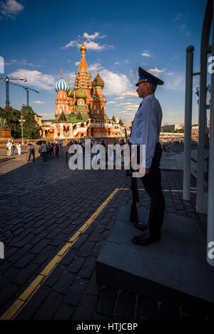 Russian police at the door of Kremlin with St. Basil church at background, Moscow Stock Photo