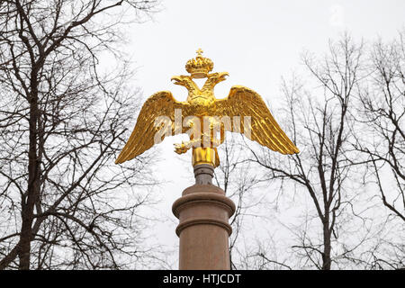 Golden Double Eagle mounted on stone column, Russian Federation coat of arms Stock Photo