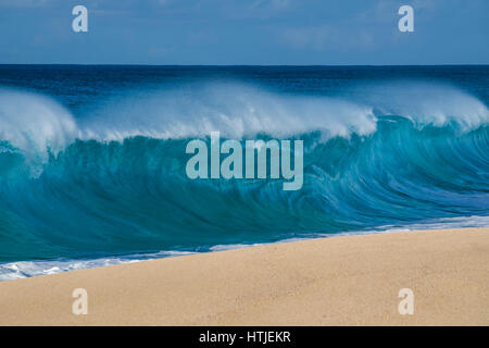 A shore break wave at Keiki beach on the North Shore of Oahu. Stock Photo