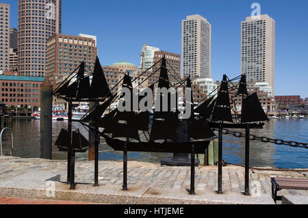 Artwork in front of the John Joseph Moakley Courthouse with the downtown Boston waterfront and skyline behind Stock Photo