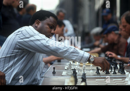 Chess Player at Sidewalk Concession Stock Photo