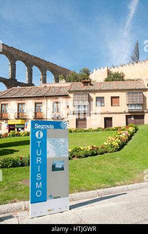 Tourist sign and Roman aqueduct. Segovia, Castilla Leon, Spain. Stock Photo