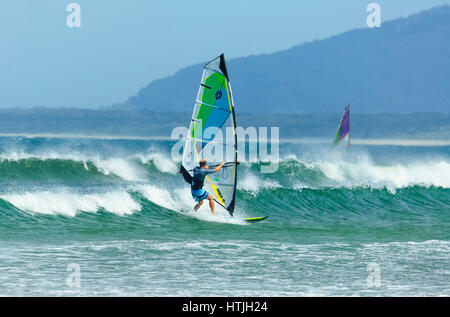 Windsurfer surfing in heavy seas with large waves at Seven Mile Beach, Gerroa, Illawarra Coast, New South Wales, NSW, Australia Stock Photo