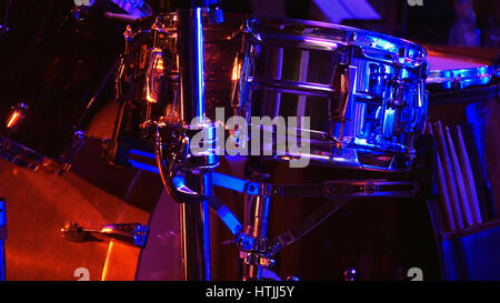 Drum set in the stage in soundlights ready to be played on by drummer Stock Photo