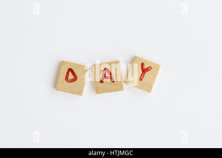 the word Day  formed with letters written on squares of wood dowels Stock Photo