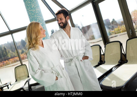 Happy coupleenjoying treatments and relaxing at wellness spa center Stock Photo