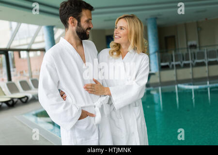 Happy coupleenjoying treatments and relaxing at wellness spa center Stock Photo