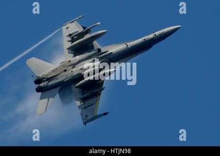 A U.S. Navy F/A-18C Hornet jet aircraft performs a high-speed turn in flight March 6, 2010 over the Philippine Sea.        (photo by MCS2 John Philip Wagner Jr. /US Navy  via Planetpix) Stock Photo