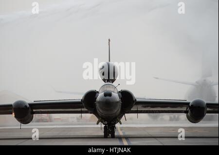 A U.S. Air Force U-2 Dragon Lady ultra-high altitude reconnaissance aircraft taxies through a ceremonial shower after completing 30,000 flight hours at Al Dhafra Air Base February 2, 2017 in Abu Dhabi, United Arab Emirates.        (photo by Tyler Woodward /US Air Force  via Planetpix) Stock Photo