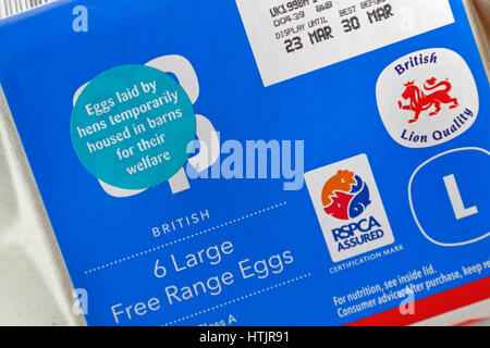 Sticker on an egg box stating 'Eggs laid by hens temporarily housed in barns for their welfare' as a measure to control the spread of Avian Flu in UK. Stock Photo