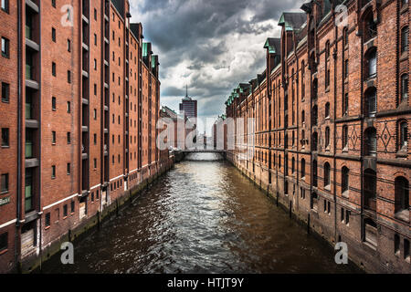 Famous Speicherstadt warehouse district with dark clouds before the storm in Hamburg, Germany Stock Photo