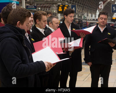 A Welsh male voice choir at Paddington Station on St David's Day Stock Photo