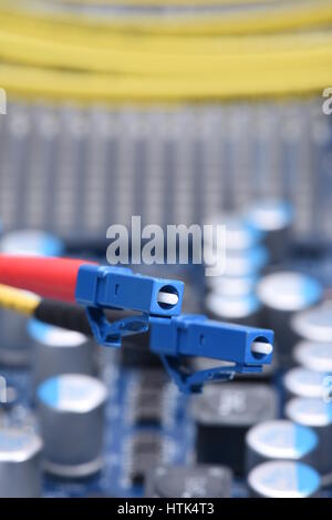 Information Technology Computer Network, Telecommunication Fiber Cable on Electronic Board Stock Photo