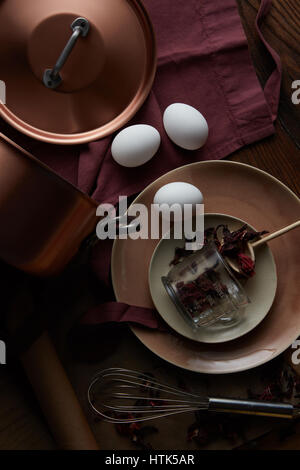 Happy Easter! Background with eggs and cooking utensils Stock Photo
