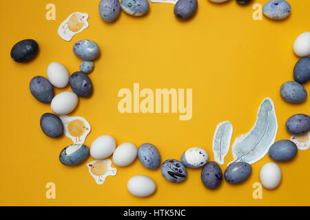 Easter holiday design with cute chickens and easter eggs in round shape on yellow background Stock Photo