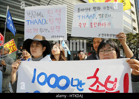 South Korea Politics, Mar 11, 2017 : People attend a rally in Seoul, South Korea, against the government's plan to deploy a Terminal High Altitude Area Defense (THAAD) battery of the U.S. Army on a Lotte golf course in Seongju, about 260 km southeast of Seoul. The U.S. and South Korea had agreed to station the anti-missile battery with a high-powered radar to counter missile threats from North Korea but China opposed the deployment as they asserted the United States will spy on Chinese military with THAAD. Korean characters read,'Impeach THAAD, Impeach Hwang Kyo-Ahn (Prime Minister and Acting Stock Photo
