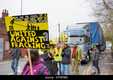 Atherton, Lancashire, UK. 13th March 2017. Early this morning a small group of anti-fracking protesters from Bolton, Manchester and Warrington held a 'pop-up' protest outside SIBGAS at an industrial estate in Atherton near Leigh, Greater Manchester. Pop-up protests are being held against companies found to be supplying Cuadrilla, a fracking company preparing an exploratory drilling operation for shale gas at Little Plumpton near Blackpool. Credit: Dave Ellison/Alamy Live News Stock Photo