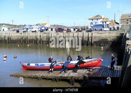 Gig rowers, West Bay, Dorset, UK. 13th March 2017.UK Weather: Sunny and warm at West Bay, Dorset. Credit: Dorset Media Service/Alamy Live News Stock Photo