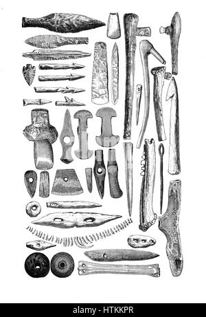 Engraving reproducing artifacts, weapons and tools made of bone and stone found in prehistorical stone age tombs Stock Photo