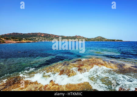 Agay bay in Esterel mediterranean red rocks coast, beach and sea. French Riviera in Cote d Azur near Cannes, Provence, France, Europe. Stock Photo