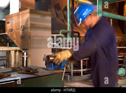 Inside the factory, who was working in the workers. Stock Photo