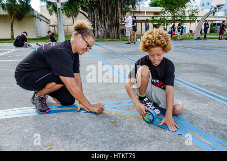 Miami Florida,Allapattah,Comstock Elementary School,Martin Luther King Jr. Day of Service,MLK,beautification project,woman female women,boy boys,male Stock Photo