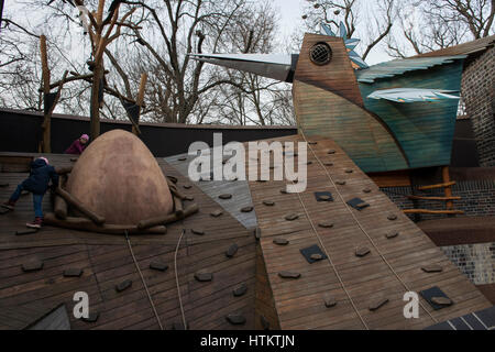 Children climbing on a wooden outdoor playground in the Leipzig Zoological Garden, Leipzig, Saxony, Germany. Stock Photo