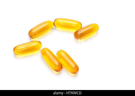 Omega 3 cod fish liver oil dietary supplement capsules containing Omega-3 fatty acid, vitamin A and D isolated on white background  Model Release: No.  Property Release: No. Stock Photo