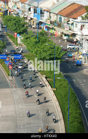 HO CHI MINH CITY, VIET NAM- AUG 11: Development of infrastructure with overpass road at intersection, number of vehicle as motorbike develop very stro Stock Photo