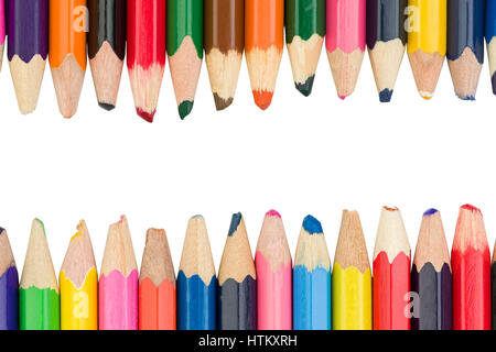 Two rows of colored pencils on top and bottom, in the middle, you can write the text Stock Photo